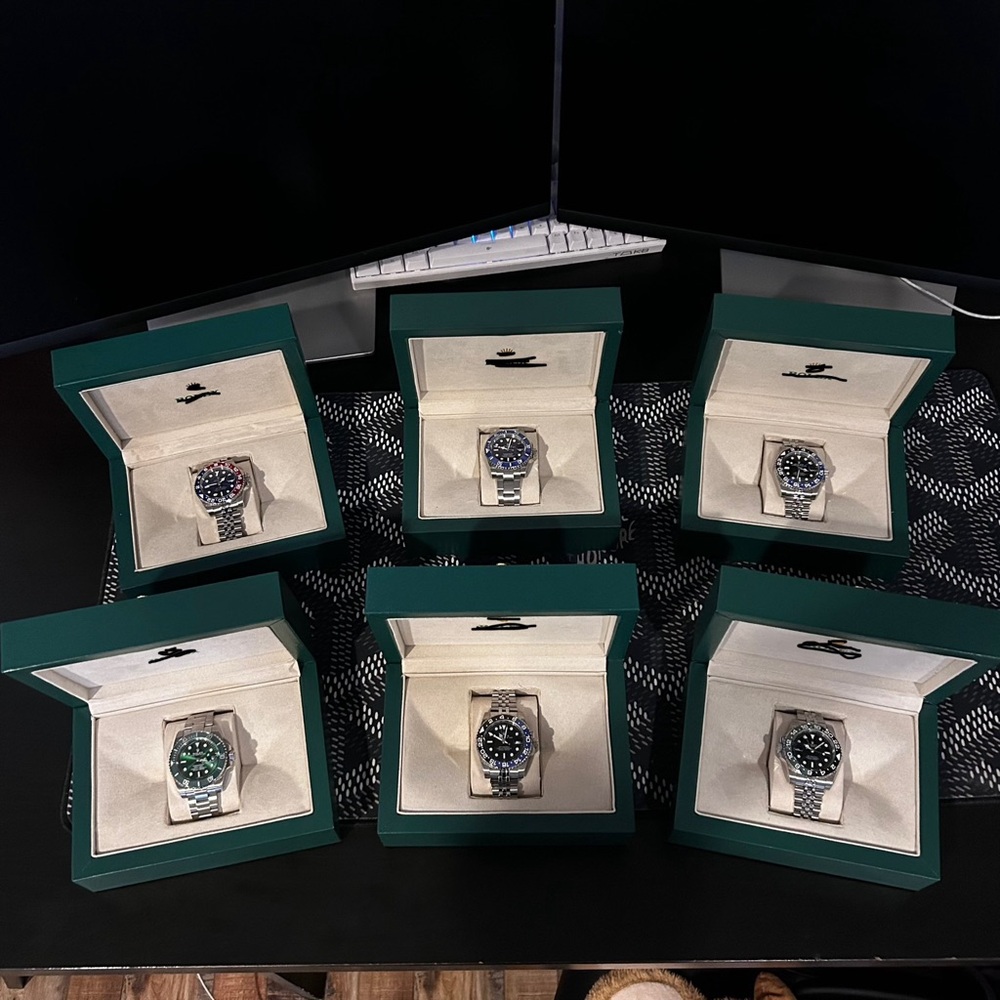 Elegant Silver Watch with Black and Green Dial